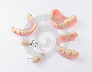 Group of dentures on white background