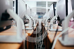 Group of desktop computers on the table in computer lab room