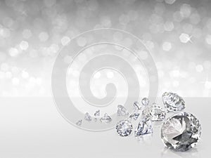 Group of diamonds placed on white background on the right with bokeh