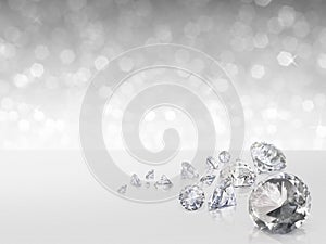 Group of diamonds placed on white background on the right with bokeh photo