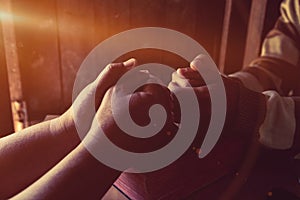 Group of different men praying together,