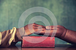 Group of different men praying together,