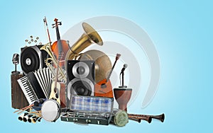 Group of different musical instruments on blue background