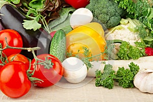 Group of different vegetables on wooden board