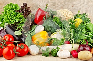 Group of different vegetables on wooden board