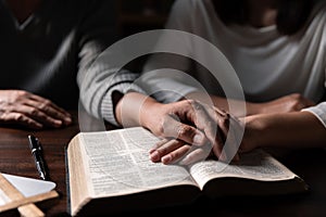 Group of different women praying together, Christians and Bible study concept