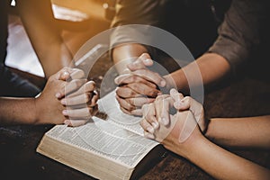 Group of different women praying together photo