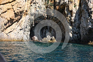 Group of divers in a natural cave in the beautiful Mediterranean Sea