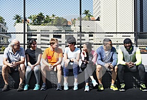 Group of diverse athletes sitting together