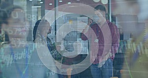 A group of diverse business people are discussing work during a meeting at the office