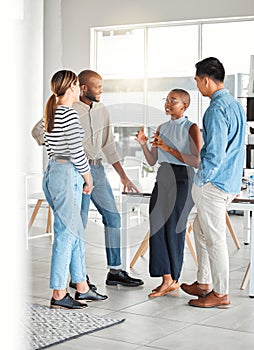 Group of diverse businesspeople having a meeting in a modern office at work. Young african american businesswoman