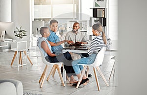 Group of diverse businesspeople having a meeting in an office at work. Young african american businesswoman talking to