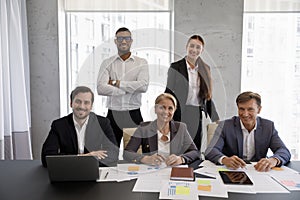 Group of diverse businesspeople posing in office for corporate picture