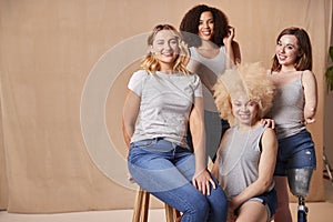 Group Of Diverse Casually Dressed Women Friends One With Prosthetic Limb Promoting Body Positivity