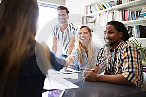 Group of diverse designers, business people brainstorming on meeting in office