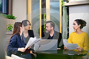Group of diverse employees business people team during brainstorming. They are discussing new ideas for the new project.