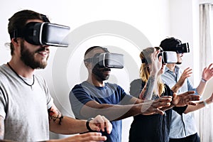 Group of diverse friends experiencing virtual reality with VR headset