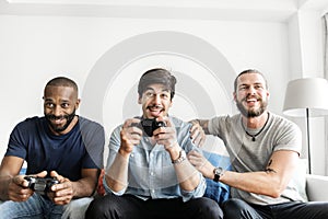 Group of diverse friends having vdo competition game photo