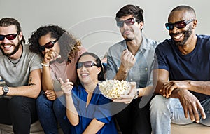 Group of diverse friends watching 3D movie together