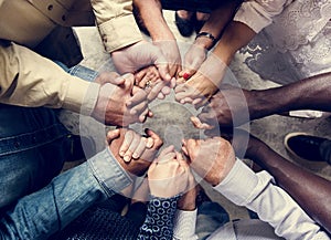 Group of diverse hands holding each other support together teamwork aerial view