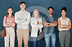 Group of diverse happy businesspeople standing in a line in an office together. Five expert business professionals