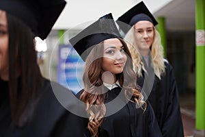 Group of diverse international graduating students celebrating