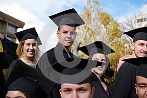 Group of diverse international graduating students celebrating