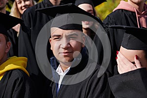 Group of diverse international graduating students celebrating