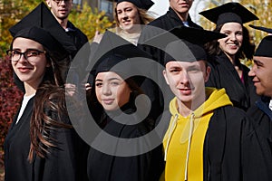 Group of diverse international graduating students celebrating