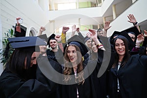 Group of diverse international graduating students celebrating