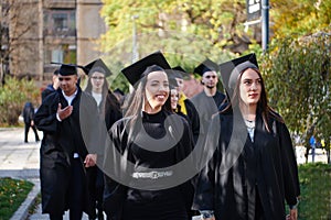 Group of diverse international graduating students celebrating