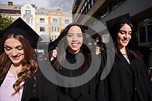 Group of diverse international graduating students celebrating