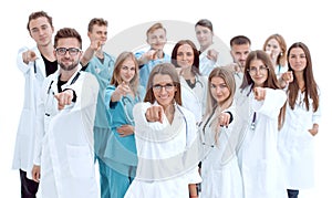 group of diverse medical professionals pointing at you