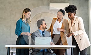 Group of diverse multiethnic business people and software developers working as a team in office