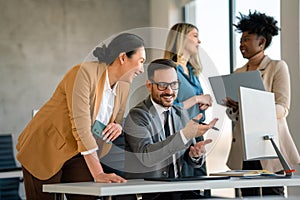 Group of diverse multiethnic business people and software developers working as a team in office