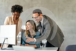 Group of diverse multiethnic business people and software developers working as a team in office