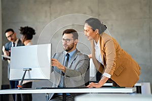 Group of diverse multiethnic business people and software developers working as a team in office