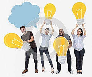 Group of diverse people with bright light bulbs and a blank speech bubble