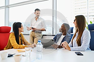 Group of diverse people discussing pitching new business ideas