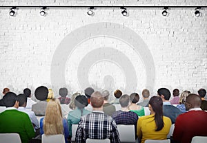 Group of Diverse People Facing White Brick Wall