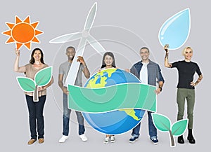 Group of diverse people holding alternative energy icons