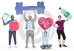 Group of diverse people holding health and fitness icons