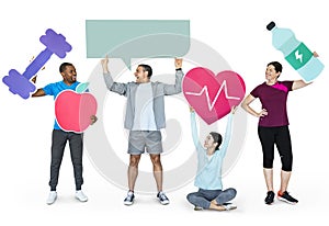 Group of diverse people holding health and fitness icons