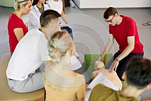 Group of diverse people practice first aid training by hand