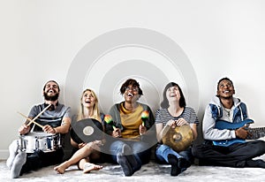 Group of diverse people together enjoying music