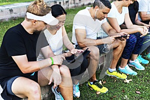 Group of diverse people using digital devices