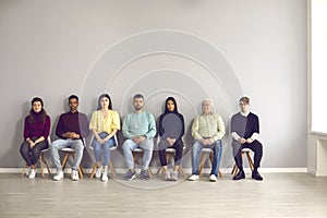 Group of diverse people waiting for their turn to see a doctor or to have a job interview