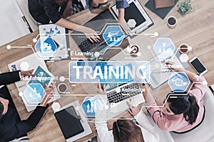 Group of Diverse Professionals Engaged in Collaborative Training Session with Digital Tools for Skill Enhancement and E