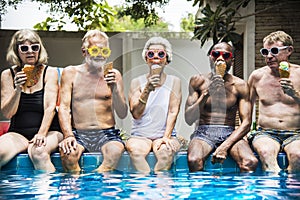 Group of diverse senior adults eating ice cream together photo