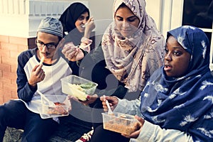 A group of diverse students are having lunch together